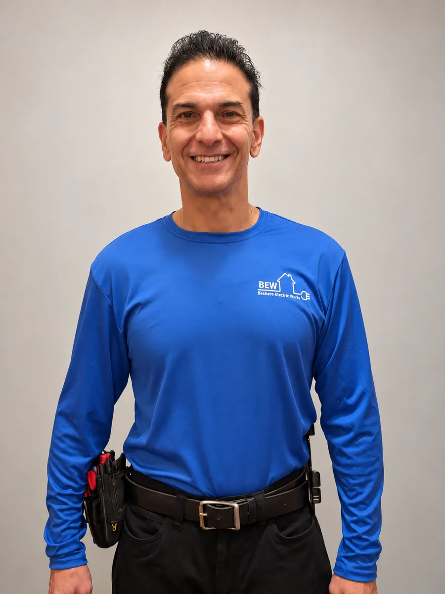 Norman Beshere wearing his blue Beshere Electric Works shirt