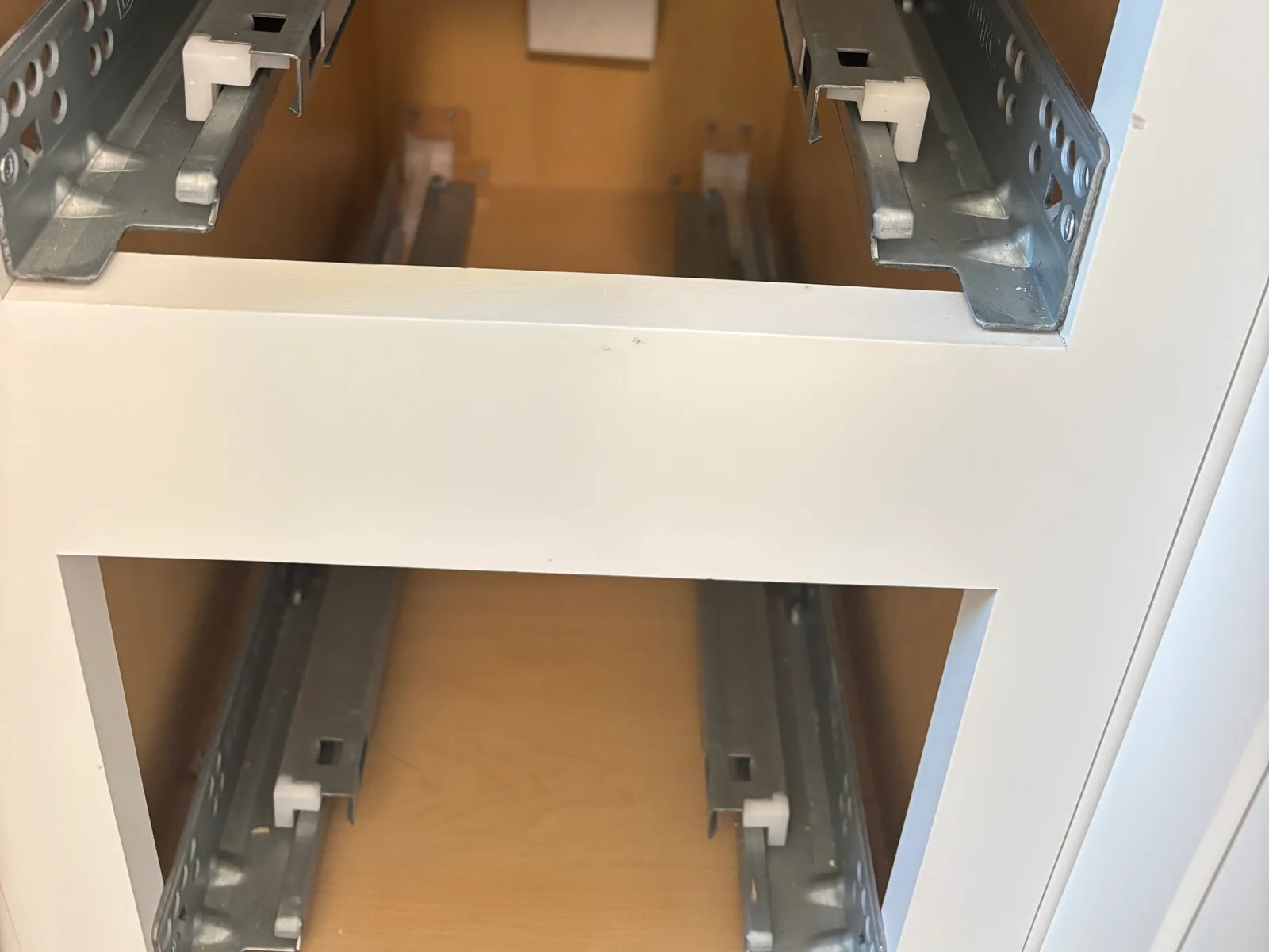 Electrical access opening inside a finished bathroom cabinet