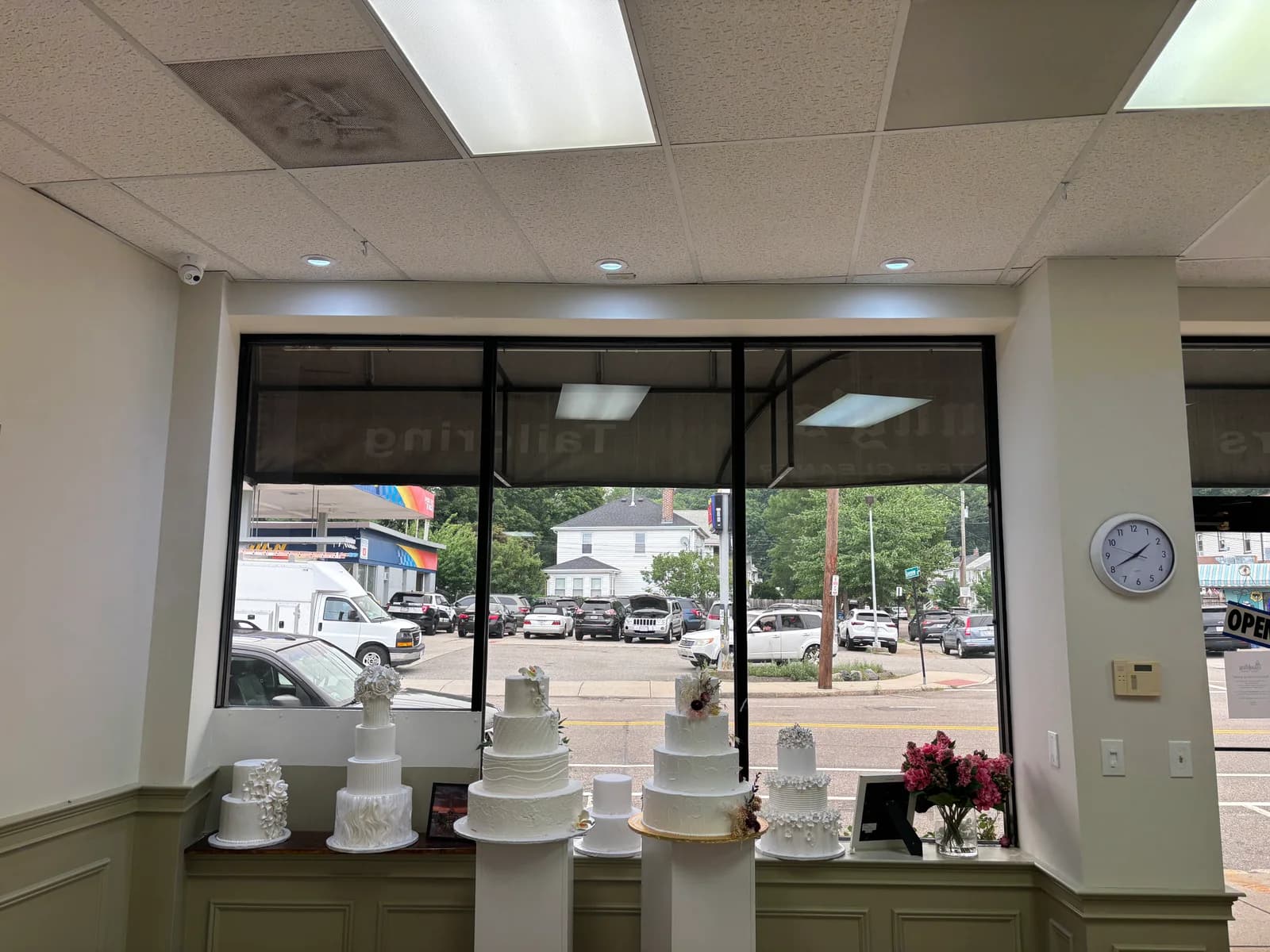 Commercial entrance illuminated by recessed ceiling lights