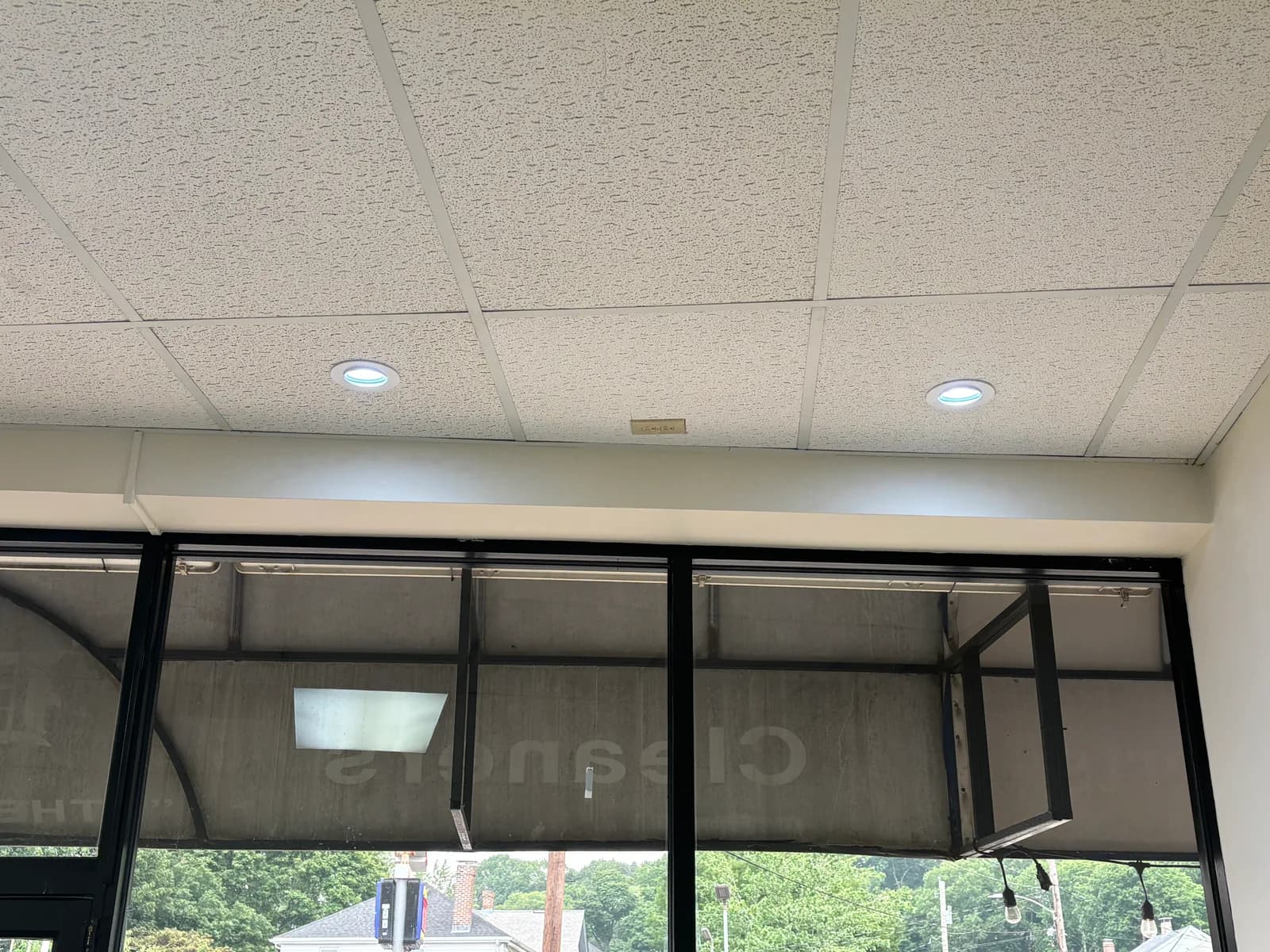 Recessed lighting installed along a commercial storefront window