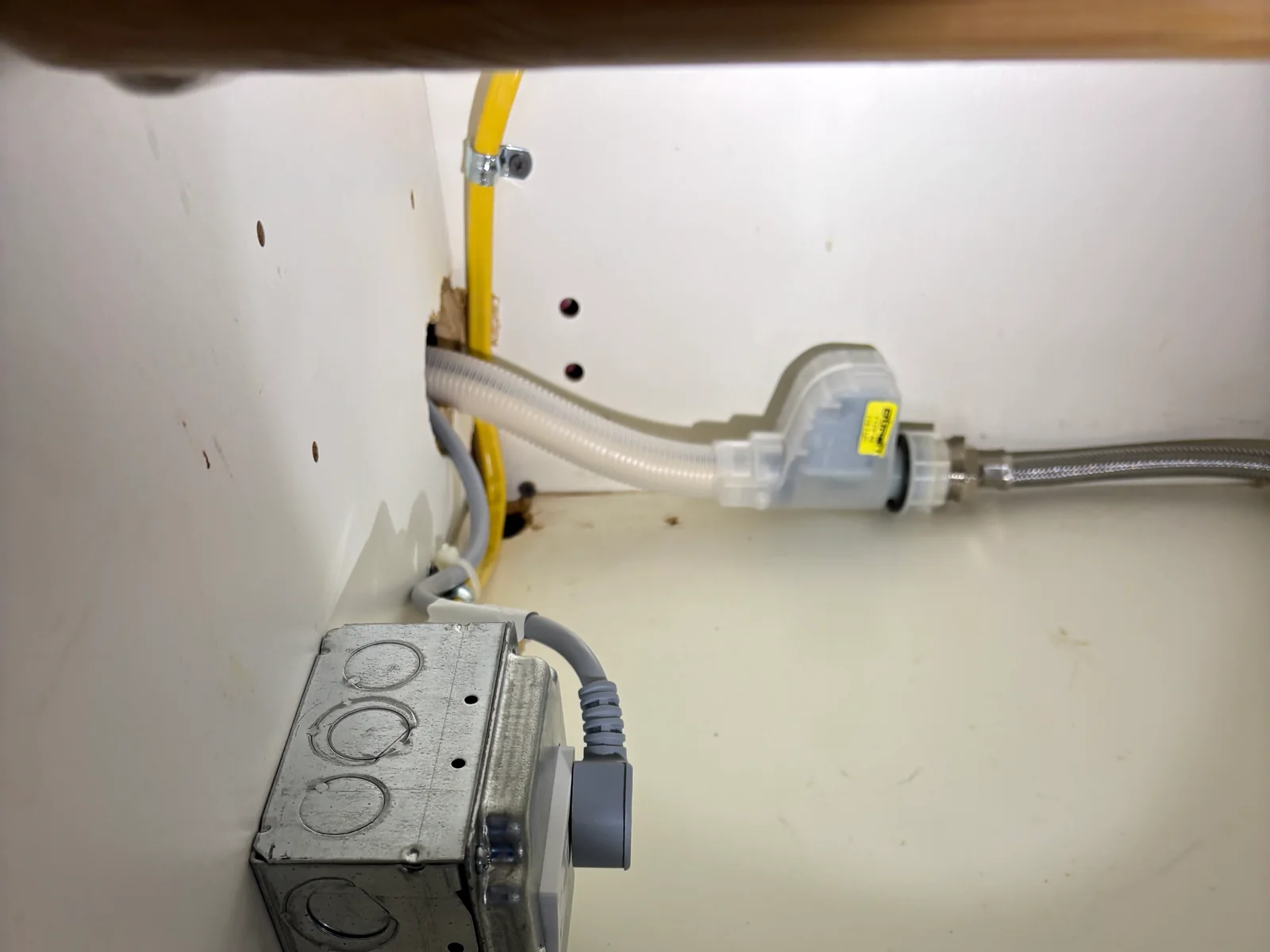 Electrical controls and secured wiring installed inside equipment housing