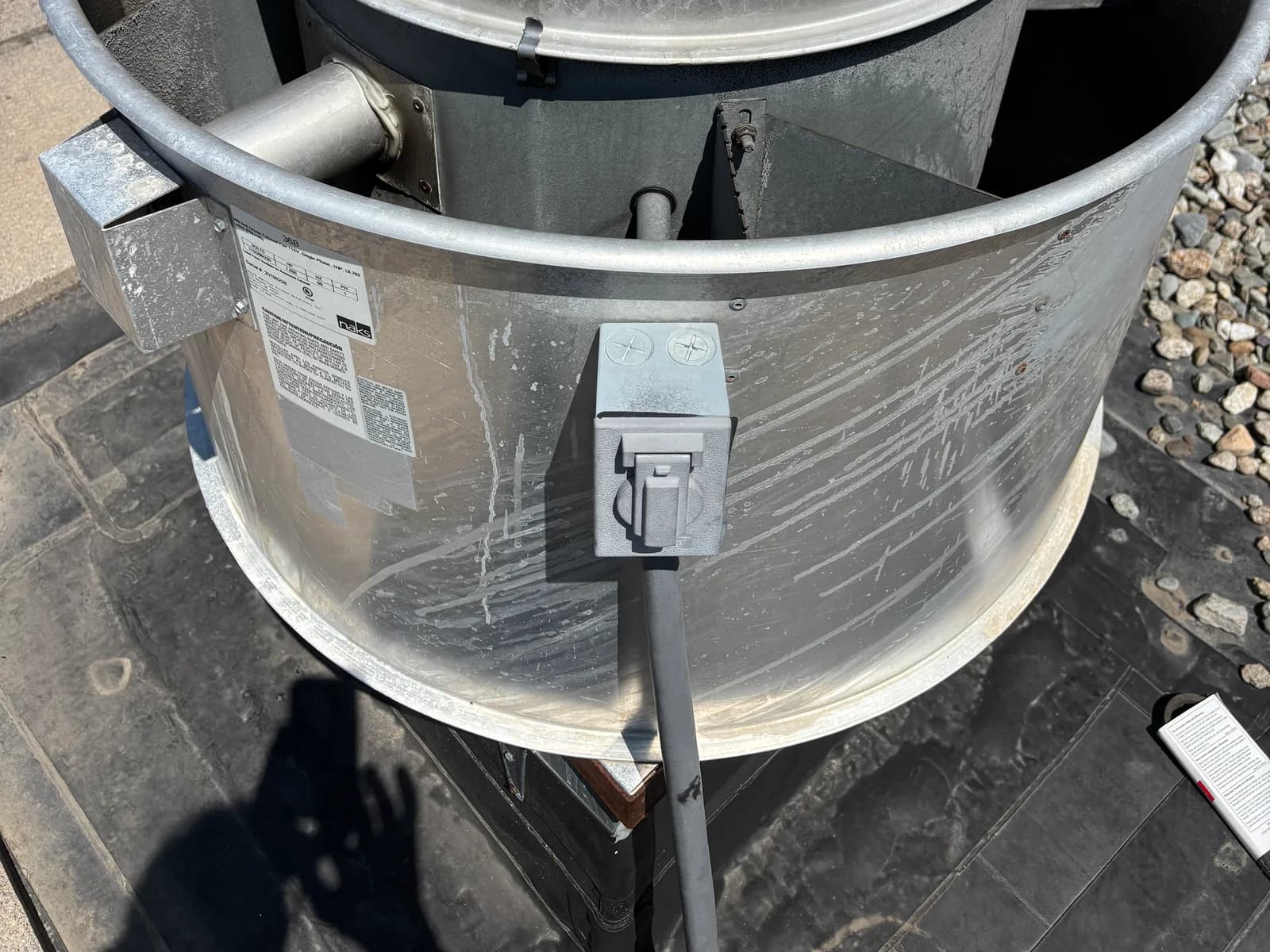 Electrical disconnect mounted beside an outdoor HVAC unit